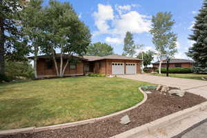 Lovely Brick Rambler on the east bench of Fruit Heights with VIEWS for days of the valley, lake, and mtns! No neighbors to the east!