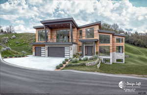 Modern home with stone siding, a balcony, an attached garage, driveway, and a front lawn