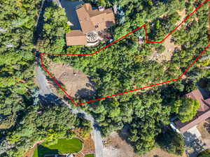 Aerial view of property and surrounding area with property boundaries highlighted