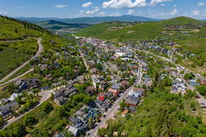 Aerial overview of property's location featuring nearby suburban area
