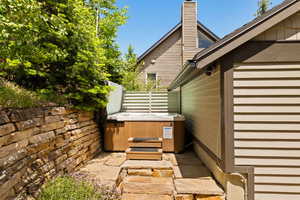 View of patio / terrace featuring a hot tub