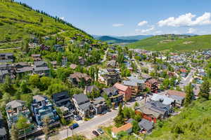 Aerial view of residential area featuring a mountain backdrop