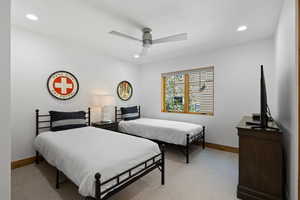 Bedroom featuring recessed lighting, light colored carpet, and ceiling fan