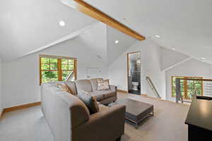 Carpeted living area featuring beam ceiling, healthy amount of natural light, high vaulted ceiling, and recessed lighting