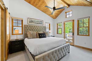 Bedroom featuring access to outside, high vaulted ceiling, light carpet, a wood ceiling with exposed beams, and ceiling fan
