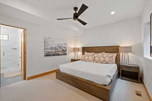 Bedroom with carpet, ensuite bathroom, recessed lighting, and a ceiling fan
