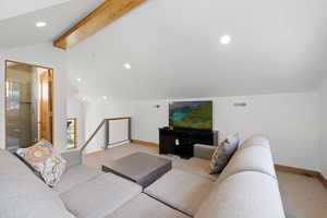 Living room with light carpet and recessed lighting