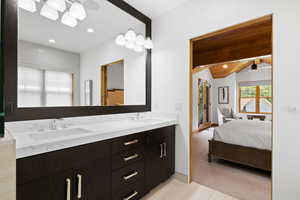 Full bath featuring double vanity, ensuite bath, wooden ceiling, and recessed lighting