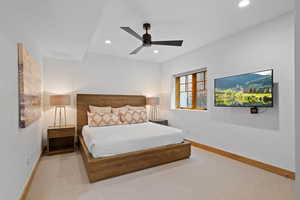 Carpeted bedroom with recessed lighting and a ceiling fan