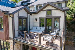 Deck with french doors and an outdoor living space