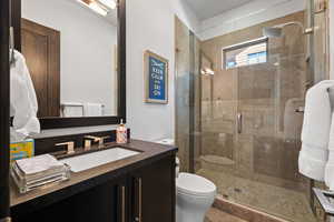 Bathroom with vanity and a stall shower
