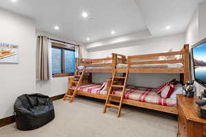 Carpeted bedroom featuring recessed lighting and baseboards