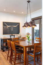 Dining space featuring wood finished floors and recessed lighting