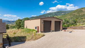 Detached garage featuring a mountain view