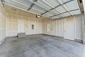 Garage featuring electric panel