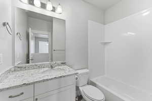 Full bathroom featuring vanity and bathtub / shower combination