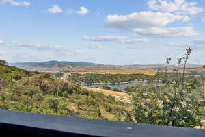 View of mountain backdrop with a large body of water