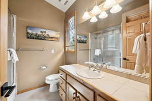Bathroom featuring vanity, an enclosed shower, tile patterned flooring, a chandelier, and a bathtub