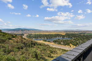 Mountain view featuring a nearby body of water