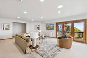 Living room featuring light carpet and recessed lighting