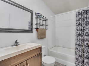 Bathroom with vanity and shower / tub combo