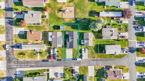 Aerial view of residential area with property parcel outlined