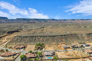 View of rural area featuring a desert landscape and a mountain backdrop