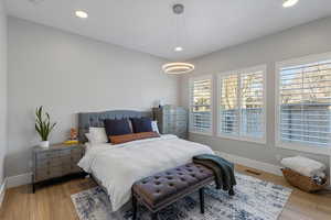 Bedroom with recessed lighting and wood finished floors