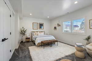 Bedroom featuring dark colored carpet and recessed lighting