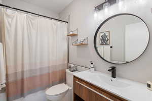 Bathroom featuring vanity and shower / tub combo