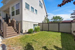 View of yard featuring stairs