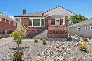 View of the front of the home with brand new roof and windows throughout.