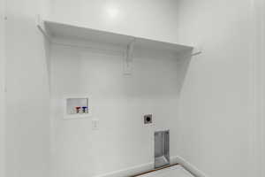 Laundry area featuring hookup for a washing machine and electric dryer hookup