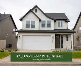 View of front facade with board and batten siding, covered porch, an attached garage, roof with shingles, and concrete driveway