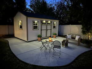 View of outbuilding with a fenced backyard