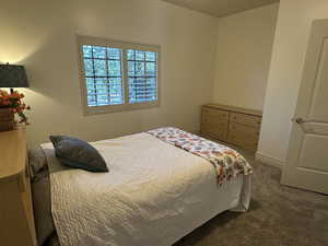 Carpeted bedroom with baseboards