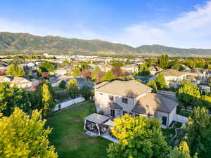Aerial perspective of suburban area featuring a mountainous background