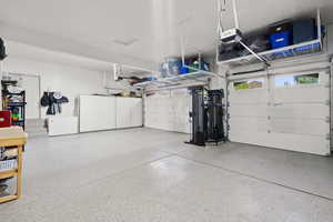 Garage featuring a garage door opener