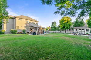 View of yard with a gazebo, a patio, and an outbuilding