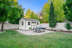 View of outbuilding featuring a fenced backyard