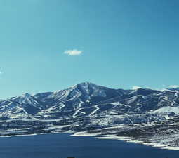 View of mountain background featuring a large body of water