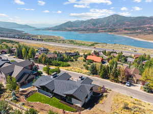 Aerial perspective of suburban area featuring a water and mountain view