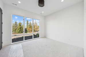 Unfurnished room featuring carpet floors and recessed lighting