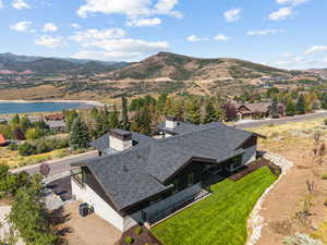 View of subject property featuring a water and mountain view