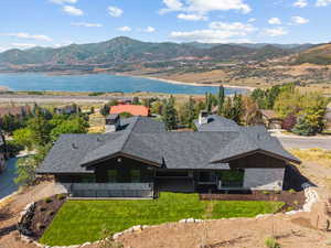 View of subject property featuring a water and mountain view