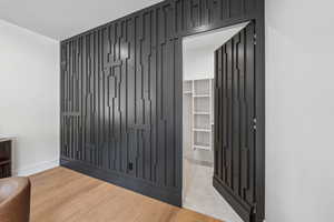Spacious closet featuring light wood-type flooring