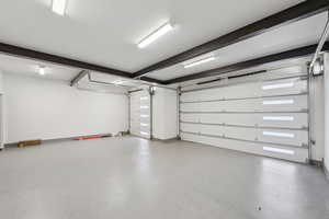 Garage featuring baseboards