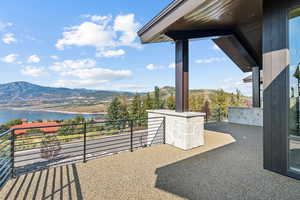 View of patio featuring a water and mountain view