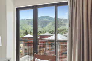 Doorway to outside featuring a mountain view