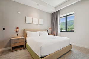 Bedroom featuring baseboards and carpet flooring
